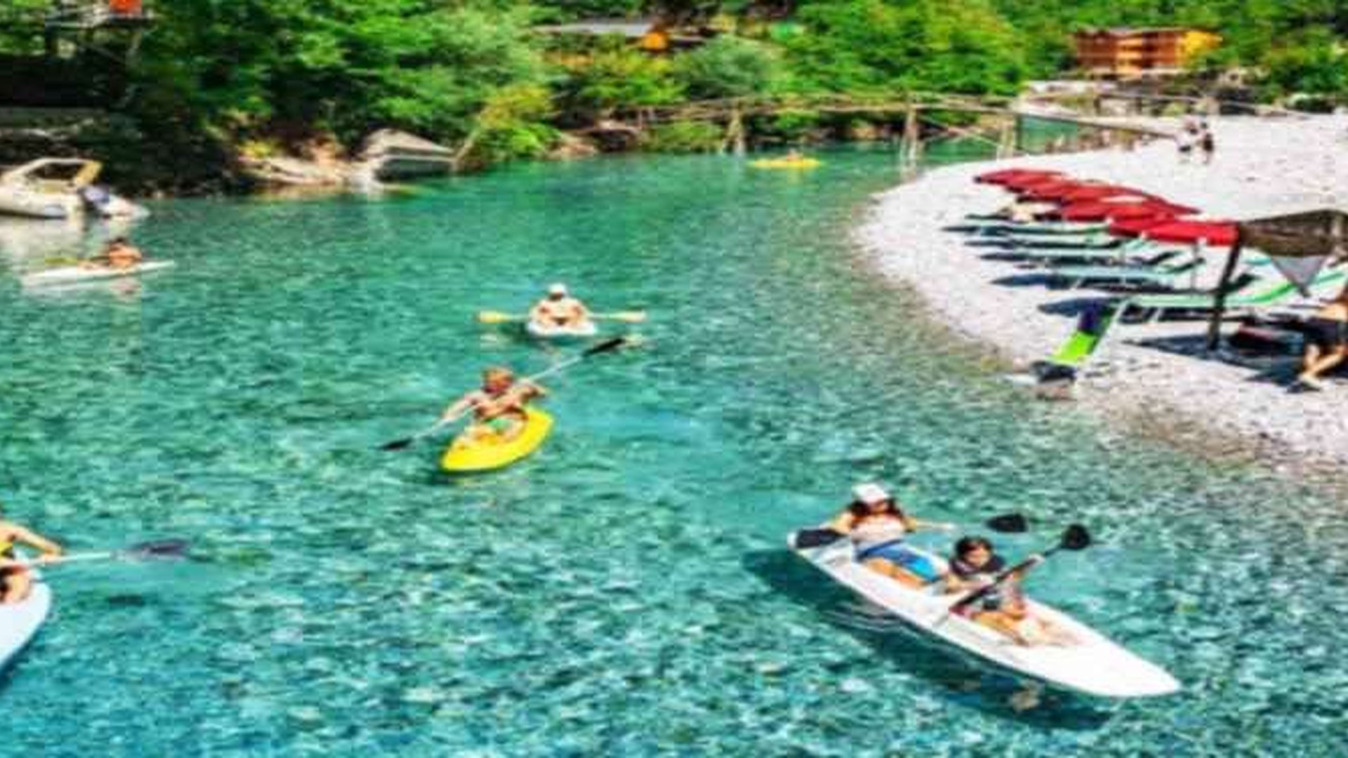 Kayaks and clear turquoise water at the Shala River