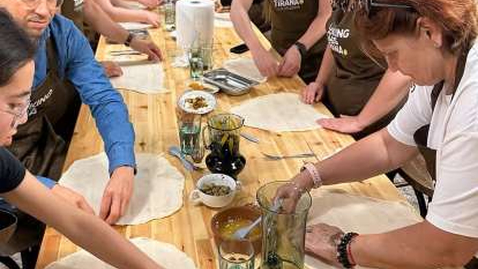 Guests preparing traditional Albanian food during a cooking in Tirana